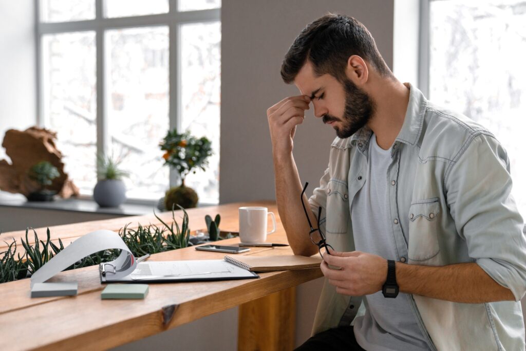 Male businessman concentrates on documents in office
